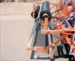 PVC roller system for grids and stiff fabrics